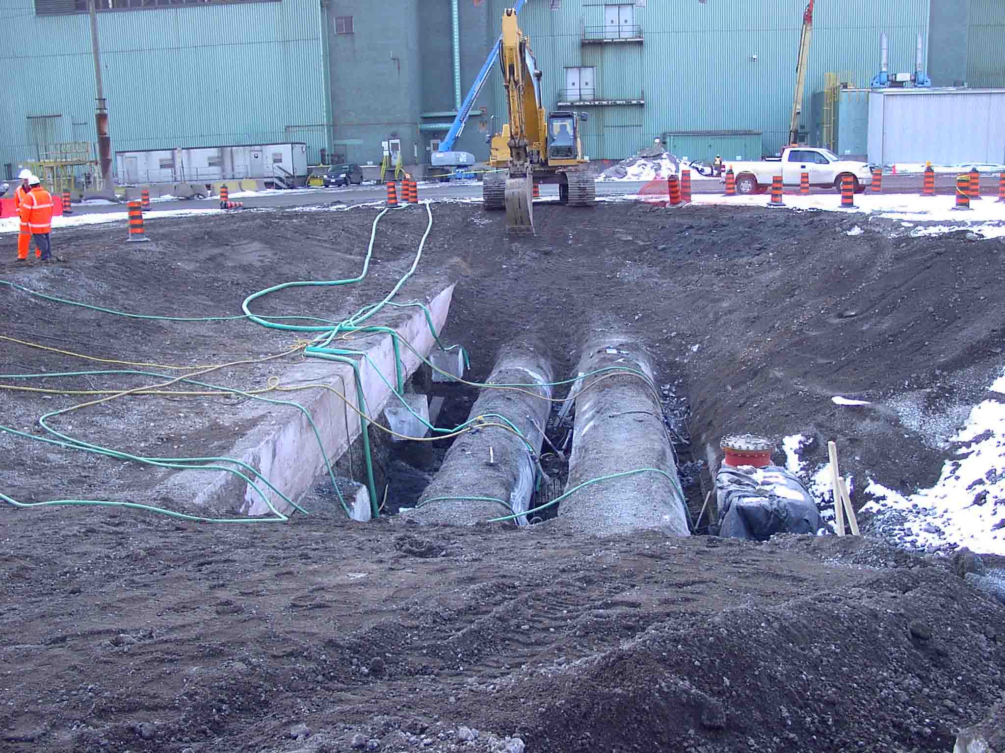 Excavation and preparation for installation of access tees into 54”, 48” and 24” watermains during a 4 day shutdown.