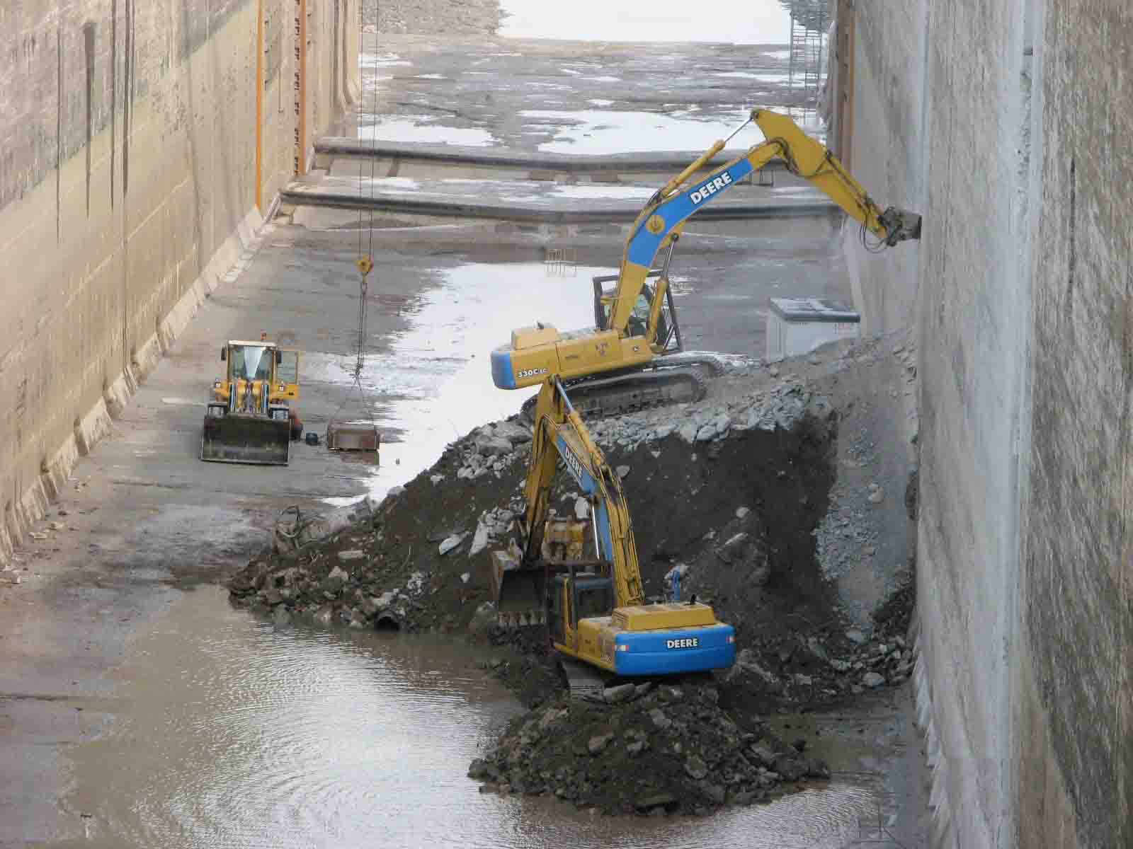 Demolition of slots into existing lock wall for new recess